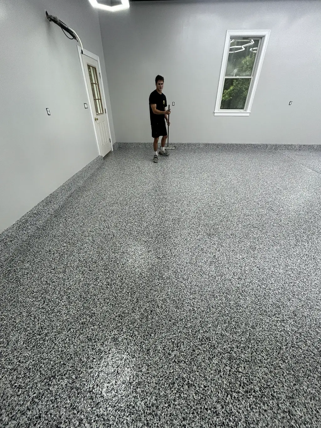 Large shop space with a finished flake floor running the length of the building